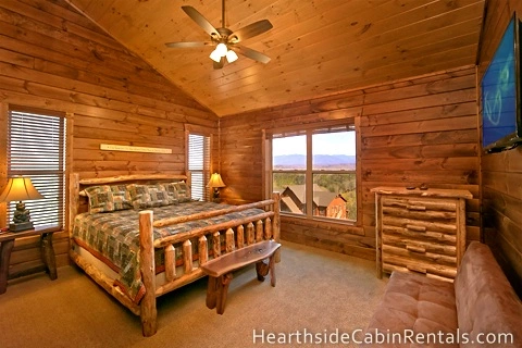 Spacious king-size bedroom with private bath and mountain view inside Pigeon Forge cabin