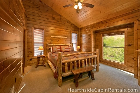 Private king-size suite with mountain view and comfortable furniture in a Pigeon Forge cabin