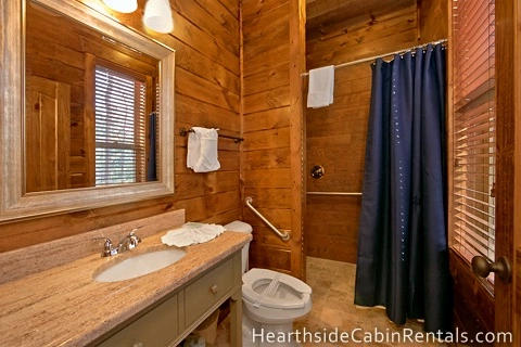 Handicap-accessible bathroom inside 8 bedroom cabin in Pigeon Forge.