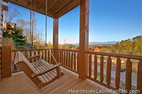  Porch swing on private deck at Mountain Top Retreat Cabin in Pigeon Forge.