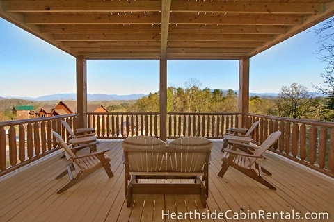Private deck overlooking the mountains with family seating at Mountain Top Retreat.