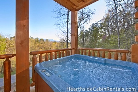  Relaxing outdoor hot tub at Mountain Top Retreat cabin in Pigeon Forge.