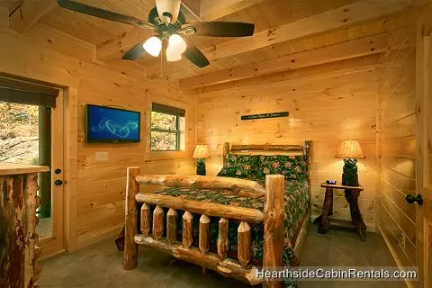  A View for All Seasons cabin near Gatlinburg queen bedroom with flat-screen tv