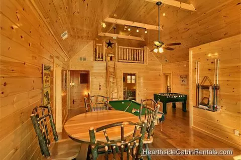 Game room and secluded loft area at A View For All Seasons cabin near Gatlinburg