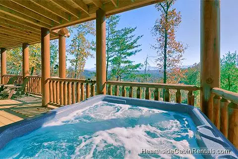 Mountain view from outdoor hot tub at A View For All Seasons cabin near Gatlinburg