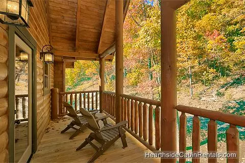A View for All Seasons cabin near Gatlinburg with covered deck and wooded view