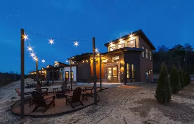 cabin with fire pit at night